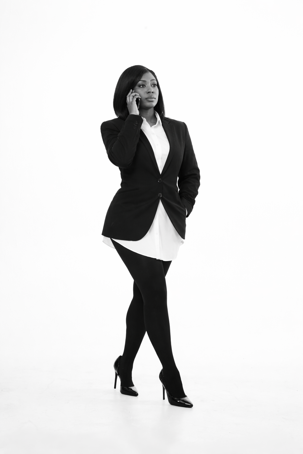 Black-and-white brand portrait of Christlie holding a phone